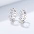 Round C-shaped diamond studded zircon earrings