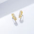 Round C-shaped diamond studded zircon earrings