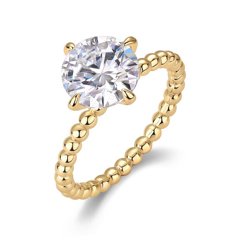 Gold-toned style 925 silver four-prong ring with moissanite comes with certificate