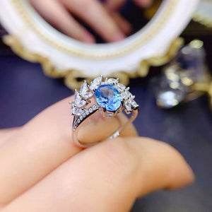 Real oval cut topaz ring
