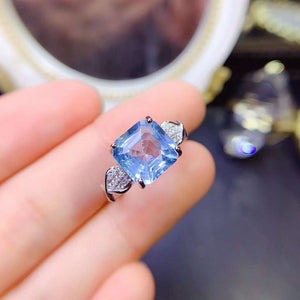 Real blue topaz emerald cut diamond ring