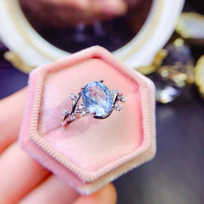 Genuine blue topaz oval cut diamond ring