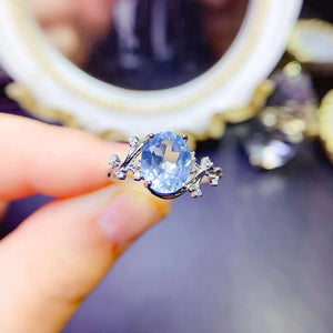 Genuine blue topaz oval cut diamond ring