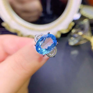 Genuine blue topaz oval cut ring