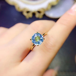 Genuine blue topaz round cut ring
