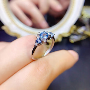 Genuine blue topaz round cut diamond ring
